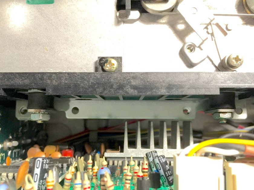 SX-64 Second Floppy Drive Mounting Solution-- screws with integrated rubber bushings as spacers.