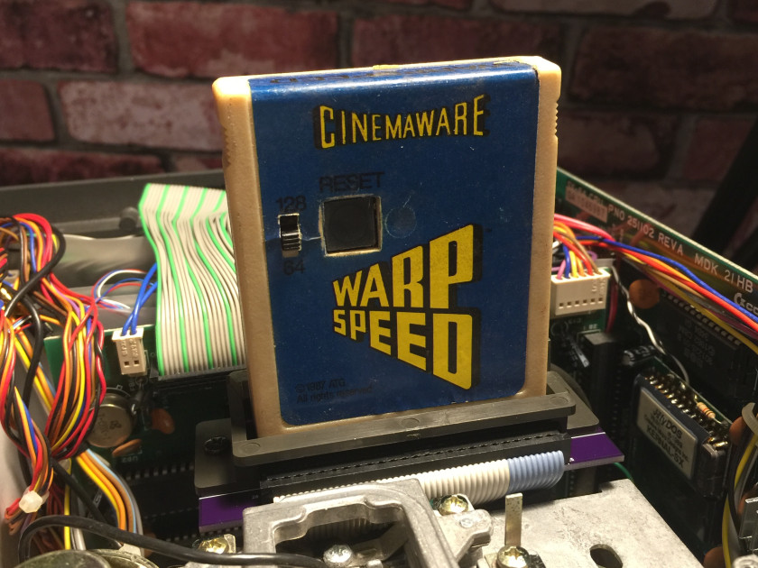 Warp Speed cartridge plugged into SX-64 new short expansion board PCB (shown without top case cover).