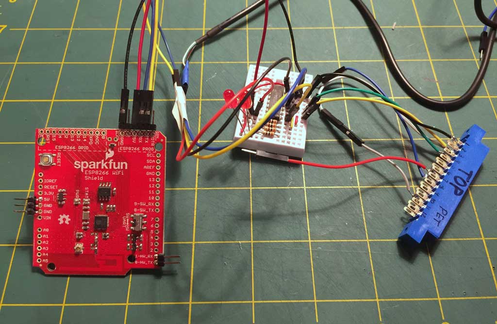 ESP 8266 wired to Commodore PET user port edge connector through a 7404 inverter circuit.