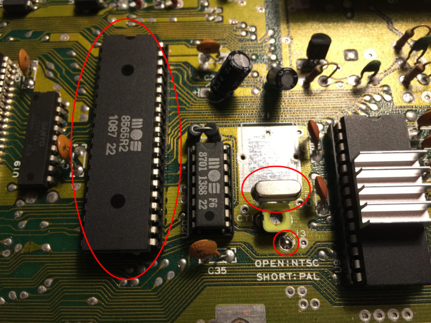 A C64 short board, showing PAL specific components (circled) converted from NTSC.